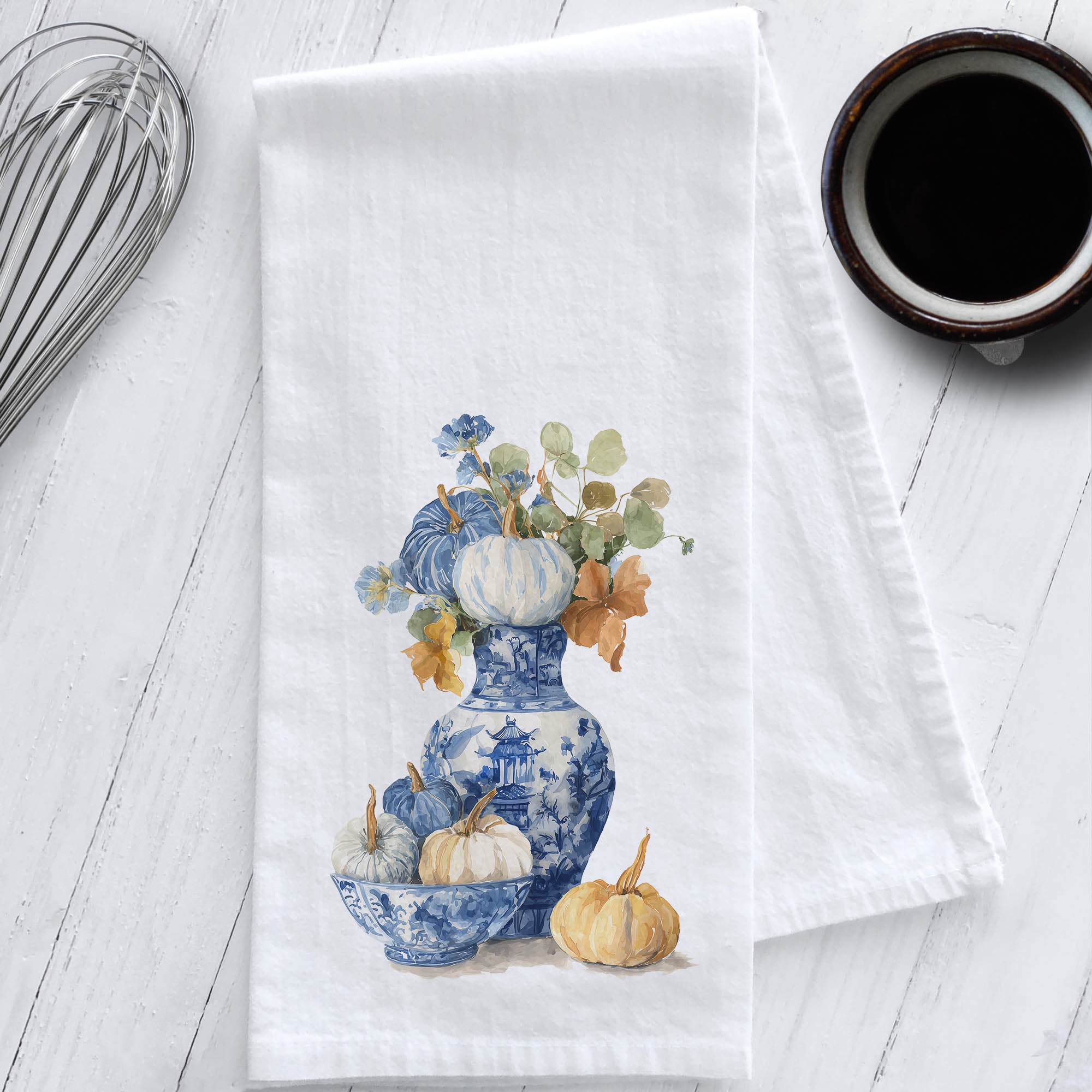 Watercolor chinoiserie fall tea towel featuring a blue and white vase and bowl with pumpkins and florals, printed on white cotton flour sack fabric.
