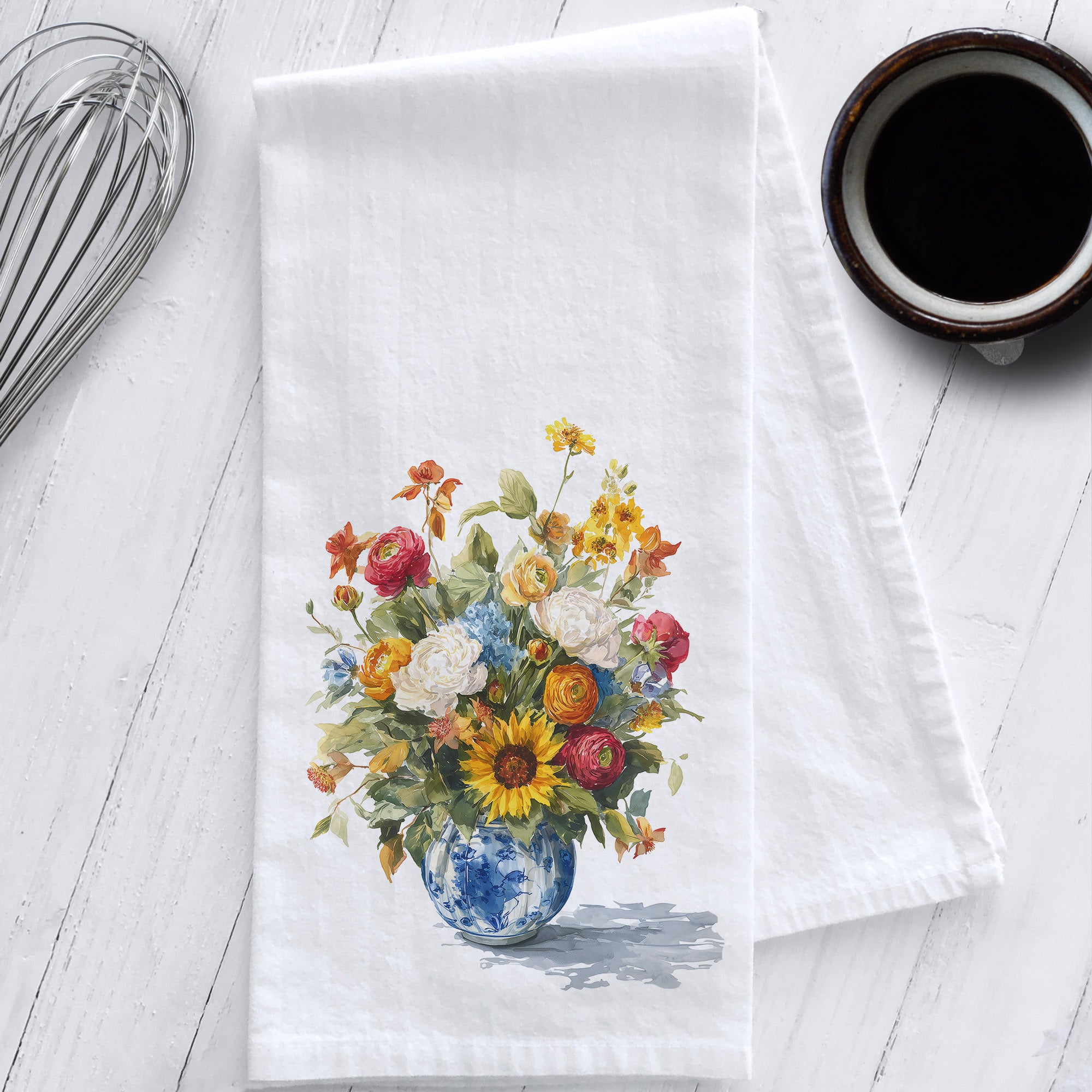 White flour sack tea towel featuring vibrant fall watercolor flowers in a blue and white chinoiserie vase; styled on white kitchen counter.